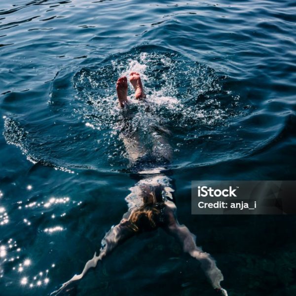 Young woman diving in the sea